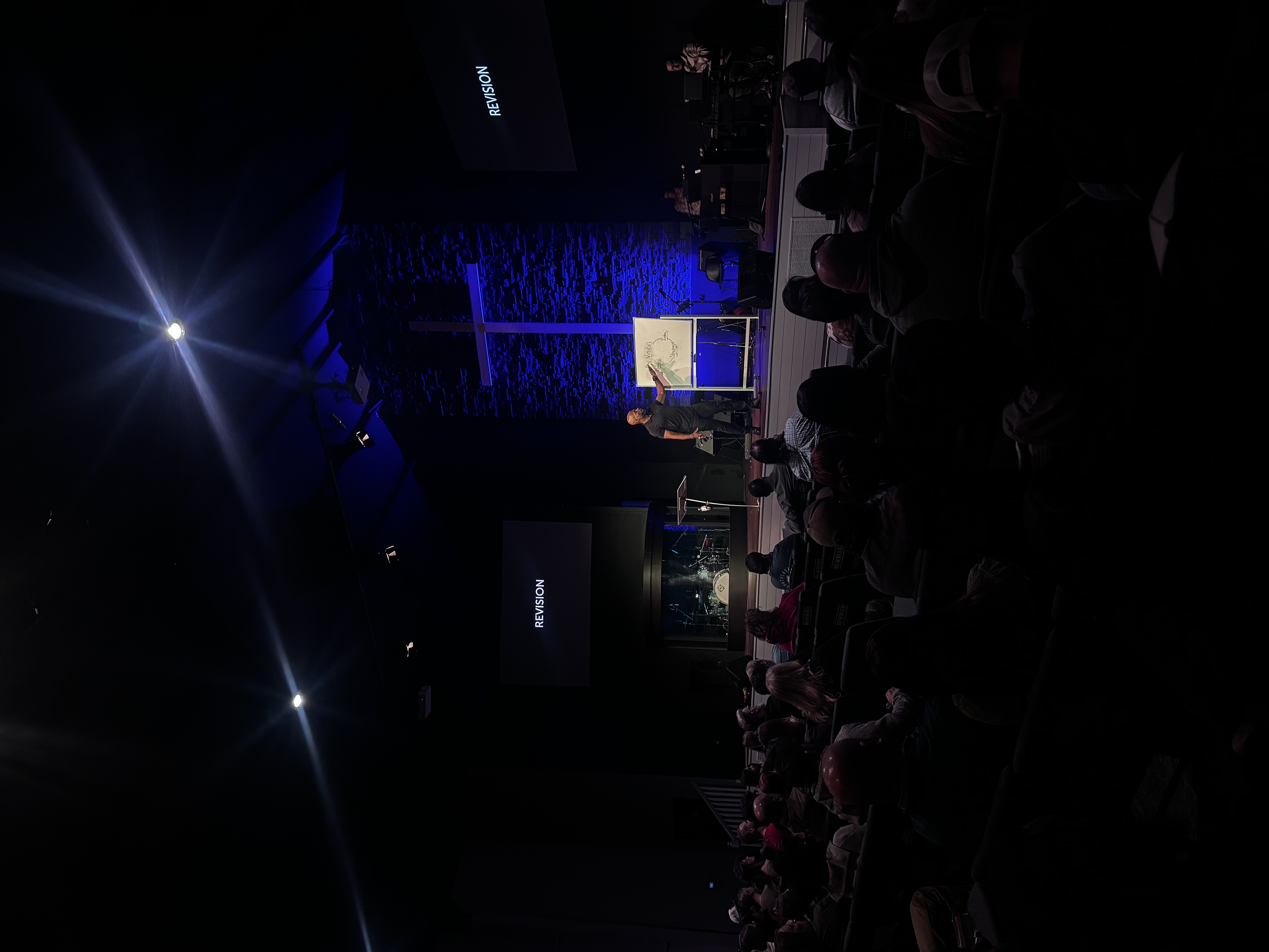 Mondoe Davis speaking at a large event